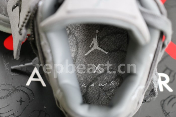 Authentic Kaws x Air Jordan 4 “Cool Grey” GS